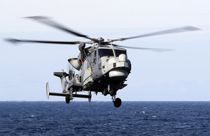 Type 45 Destroyer HMS Duncan's Lynx Wildcat lands on the ship's flightdeck. Crown Copyright