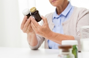 Lady looking at medicine