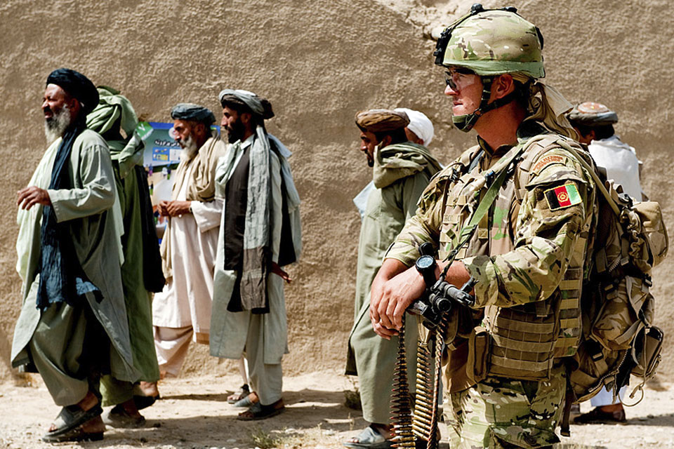 A member of the Police Mentoring Troop during a routine patrol around Sangin's bazaar 