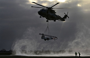 A Merlin helicopter comes in to drop off a Remover 3.1 mast during a snowy morning - Best Single Photograph Depicting the RAF Operational Experience