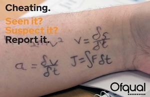 Student taking an exam; equations are written on their forearm.