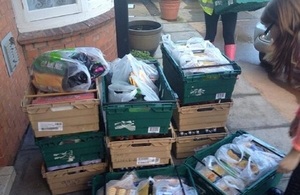 Boxes of food being delivered by volunteers