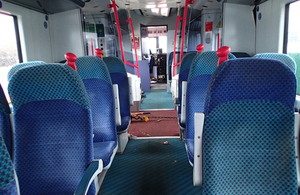 The train interior with visible distortion to the vehicle floor.