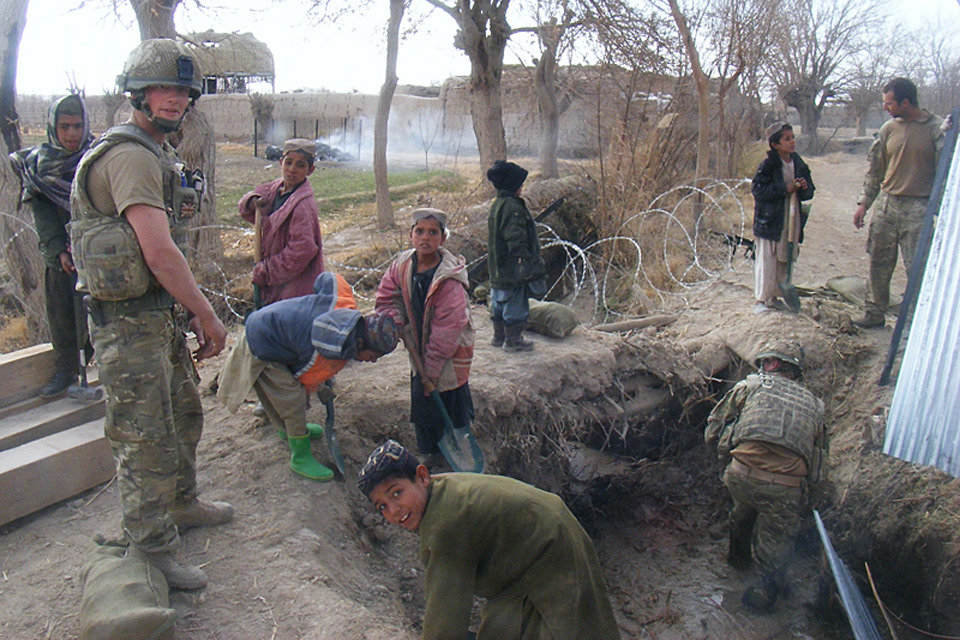 Afghan children help British engineers repair bridge