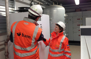 People inspecting a control room