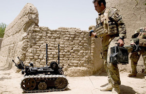 A soldier from 15 Field Support Squadron operates a Talon remote-controlled robot which forms part of the latest counter-IED technology