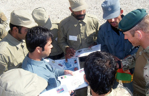 Royal Marines mentoring members of the Afghan Police