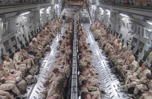 Troops inside a C-17 Globemaster transport aircraft