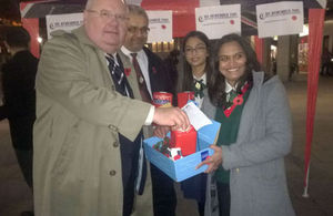 Eric Pickles donating to We Remember Too outside Westminster Cathedral