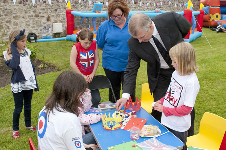 His Royal Highness Prince Andrew joins children in decorating crowns at the RAF Lossiemouth Children's Jubilee Garden Party