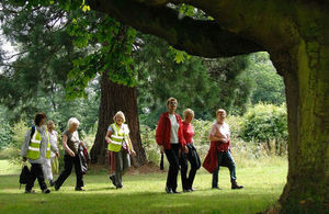 A group of women walking in the countryside.