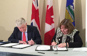British High Commissioner Howard Drake and Alberta Energy Minister Margaret McCuaig-Boyd sign a UK-Alberta Low Carbon Innovation and Growth Framework.