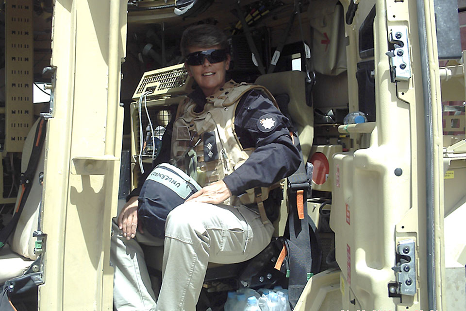 Temporary Inspector Jane Underwood in a Husky armoured vehicle