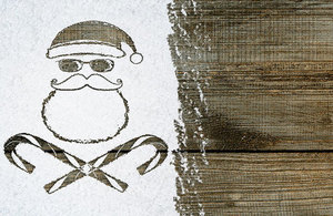 Santa image with candy canes as skull and cross bones.