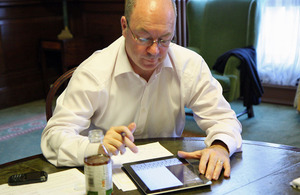 Alistair Burt answering questions on twitter.