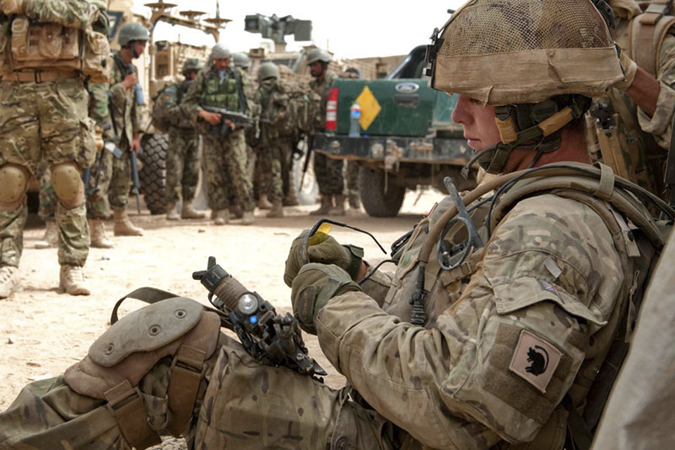British and Afghan troops muster in a compound in Nad 'Ali, Helmand province, on Day 2 of Op TOR SHEZADA 