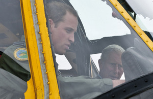 His Royal Highness The Duke of Cambridge, Flight Lieutenant William Wales, shows his father, His Royal Highness The Prince of Wales, his 'office' - the cockpit of an RAF Sea King Search and Rescue helicopter