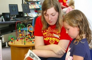 Volunteer with a young reader. Photo credit: Dorset libraries