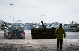 A Challenger 2 tank and other armoured vehicles from 20 Armoured Infantry Brigade being loaded onto cargo ship, before being transported to Estonia.