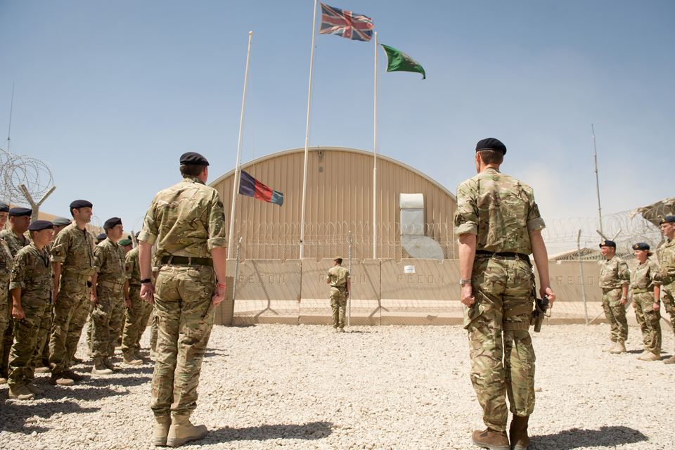The flag of the incoming command team is raised at Camp Bastion