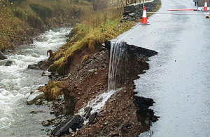 Flood damaged road.