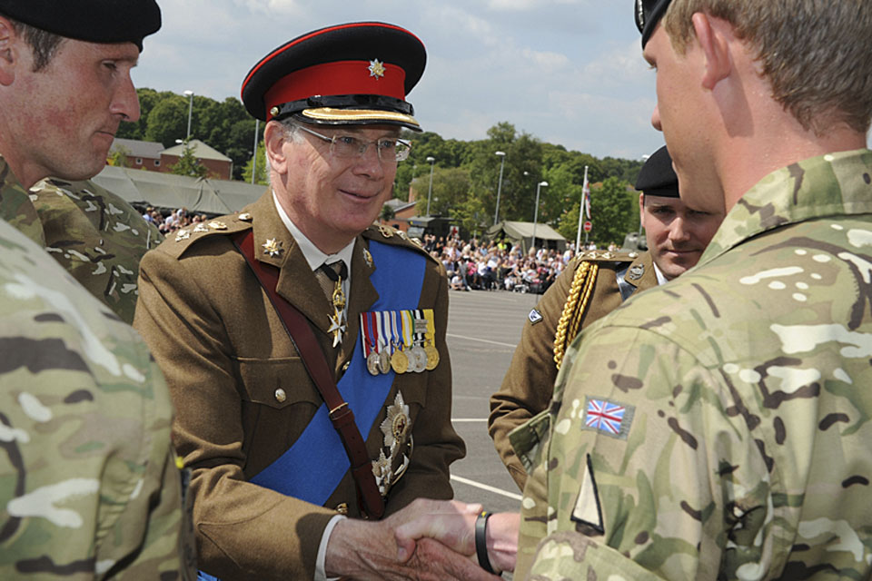 His Royal Highness The Duke of Gloucester presents soldiers of the 2nd Royal Tank Regiment with Op HERRICK campaign medals 