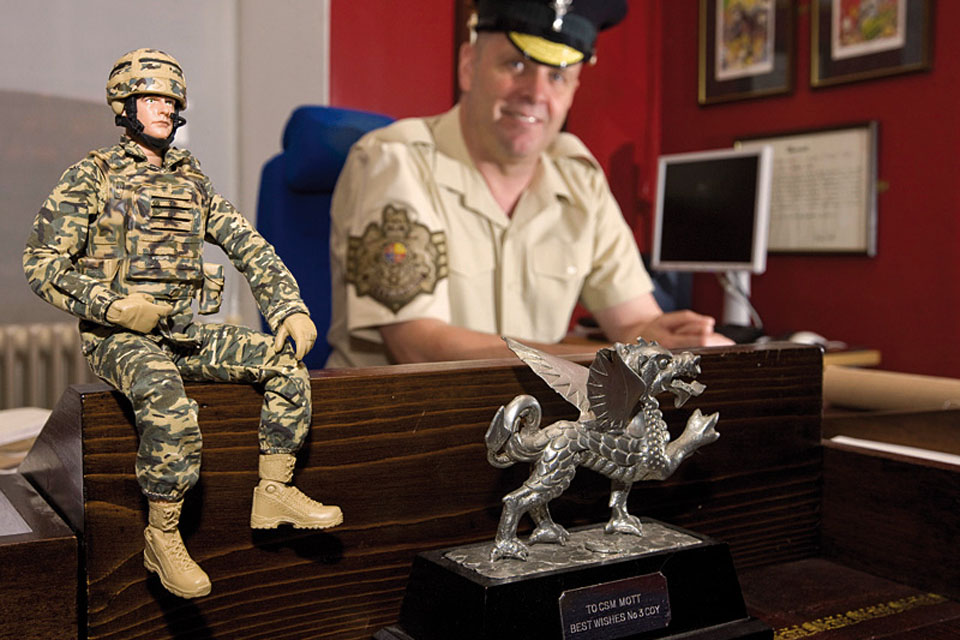Garrison Sergeant Major Bill Mott shares his London District office in Horse Guards with an HM Armed Forces infantryman action figure