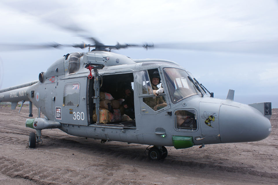 Lieutenant Luke Edwards lands HMS Manchester's Lynx helicopter on Montserrat with the bales of cannabis in the back