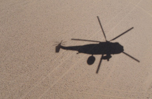 The distinctive shadow of a Sea King Mk7 Airborne Surveillance and Control helicopter