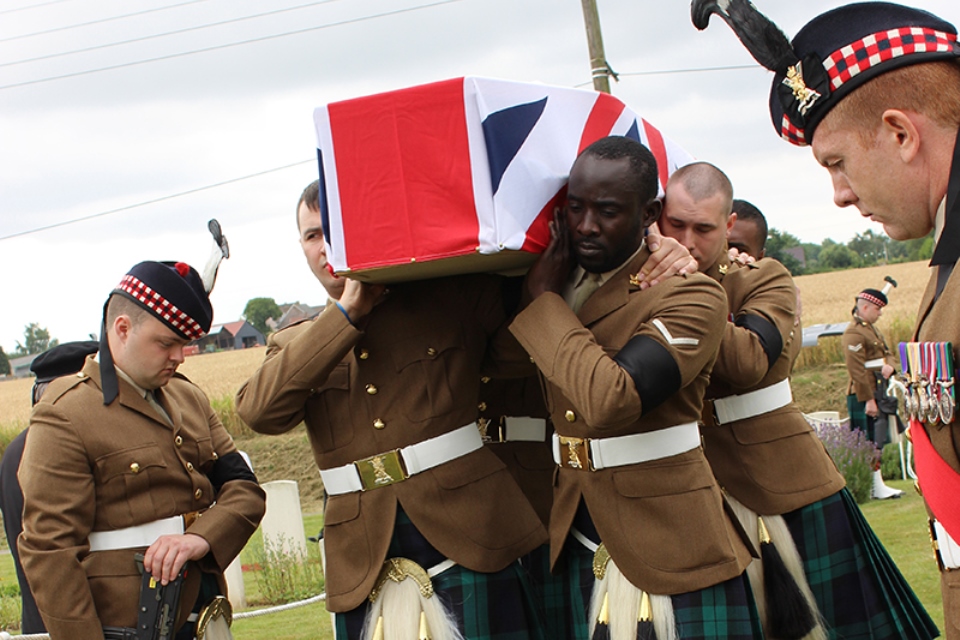 Current members of The Black Watch bring LCpl Morrison into the cemetery (Crown Copyright) All rights reserved