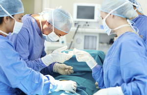 Surgeons in operating theatre