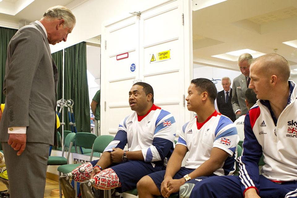 His Royal Highness The Prince of Wales talking to Paralympians Private Derek Derenalagi and Lance Corporal Netra Rana in the new Jubilee Rehabilitation Complex at Headley Court