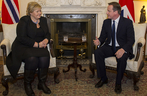 Prime Minister David Cameron talks with newly elected Norwegian Prime Minister Erna Solberg.