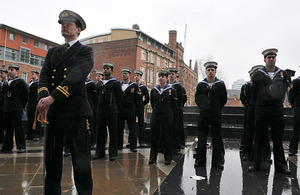 Members of HMS Manchester's ship's company form up outside Manchester Cathedral prior to their march to the Town Hall