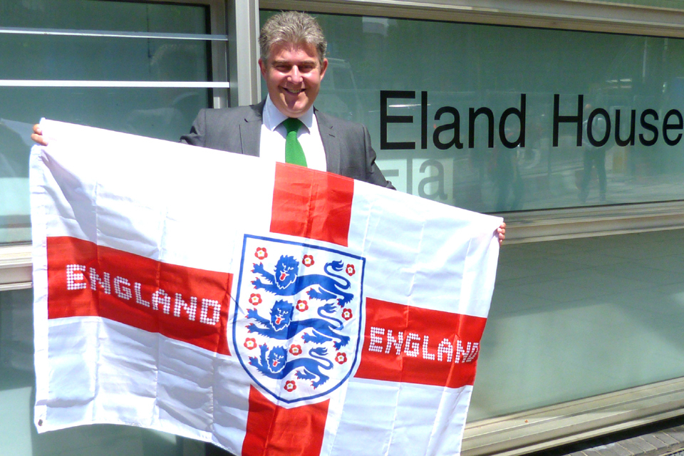 Three Lions flag gleaming above government office in support of England team