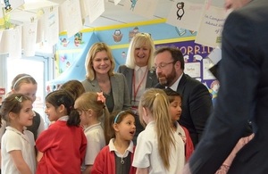 Justine Greening surrounded by primary schoolchildren