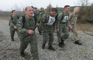 Candidates participate in a 12KM weight-carrying march around Ferizaj training area
