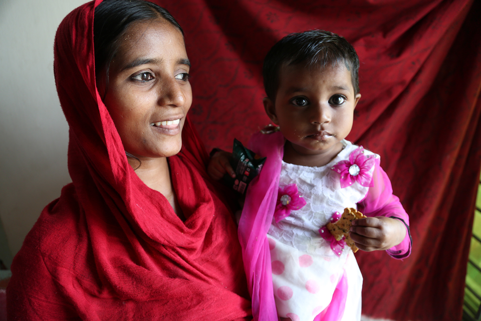  Photograph of a female worker and her child