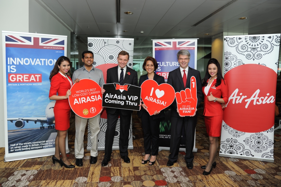 David Jones in Singapore with staff from AirAsia