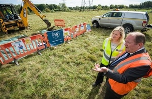 A photograph showing Joanna Larmour, Environment Agency Project Director, and Councillor Rodney Rose, Deputy Leader of Oxfordshire County Council at the ground investigation works happening in autumn 2015.
