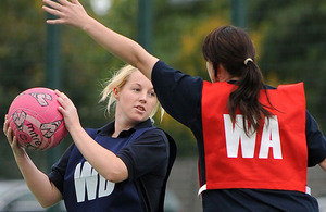 Private Kerry Smith (with the ball) competes at the British Army (Germany) Inter Unit Netball Competition