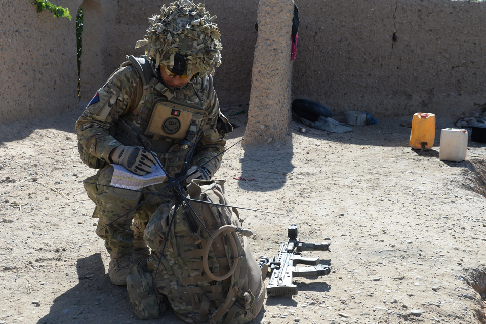 A soldier using the PRC-177F tactical satellite radio