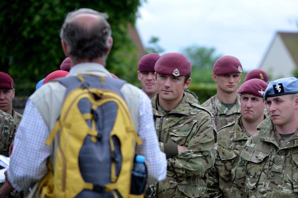 Paratroopers at a cemetery in Breville