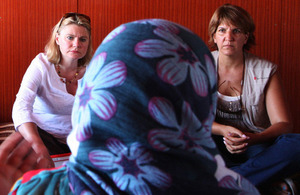 International Development Secretary Justine Greening (l), listens to a Syrian woman refugee at a Save the Children supported settlement in Lebanon's Bekaa Valley. Picture: FCO