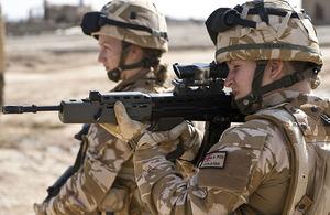 Two female British Service personnel, serving in a CIMIC (Civil-Military Co-operation) role, on patrol in Lashkar Gah, Helmand province, southern Afghanistan (stock image)