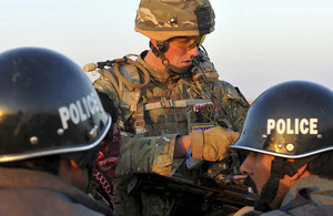 Lieutenant Luke McDonagh of D Company, 5 SCOTS, briefs his Afghan National Police colleagues on the plan of action