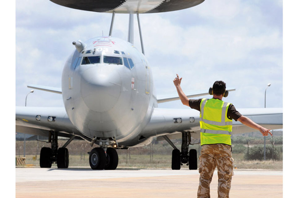 A Royal Air Force E-3D Sentry is marshalled out at Trapani, Sicily 