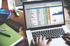 laptop with financial spreadsheet on screen