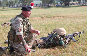 Corporal Matthews positioning a Ugandan soldier to provide all-round defence [Picture: Crown copyright]