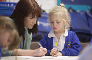 Teacher working with child